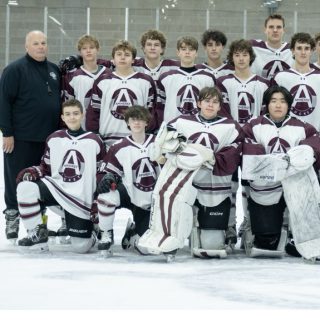 A winning coach: Michael Rousseau heads up boys’ hockey